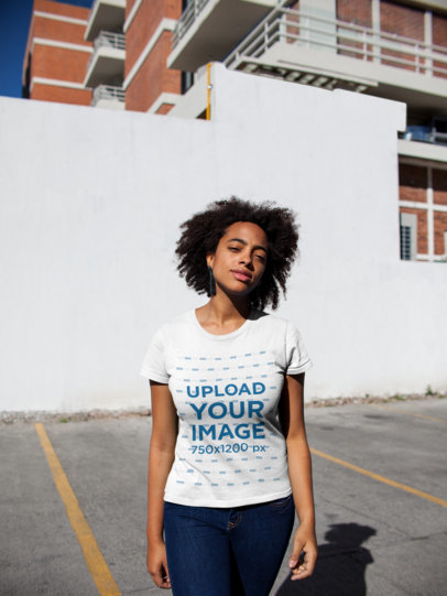 T-Shirt Mockup of a Woman with an Afro at a Parking Lot