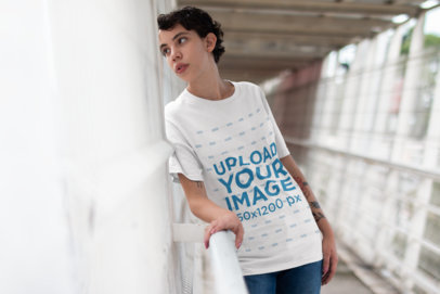 T-Shirt Mockup of a Woman Looking Out from a Pedestrian Bridge 22746