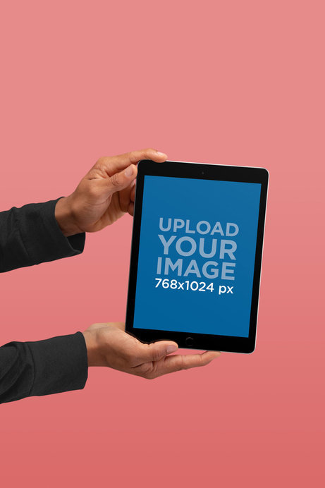 iPad Mockup Being Held Against a Solid Color Background