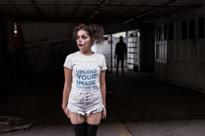 Tshirt Mockup of a Woman with Halloween Makeup with a Dark Figure Behind Her