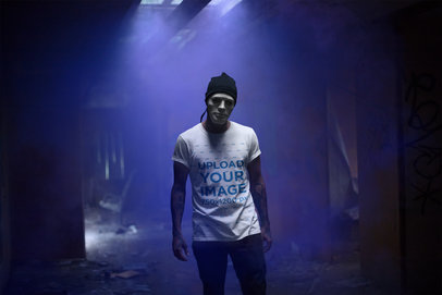 Mockup of a Man Wearing a T-Shirt and a White Halloween Mask