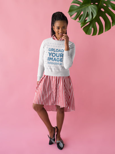 Mockup of a Woman Wearing a Sweatshirt Over a Striped Dress 18400