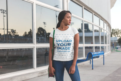 Round Neck Tee Mockup of a Woman with Braids Looking at the Horizon