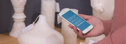 iPhone 6 Mockup Featuring a Woman at a Furniture Store