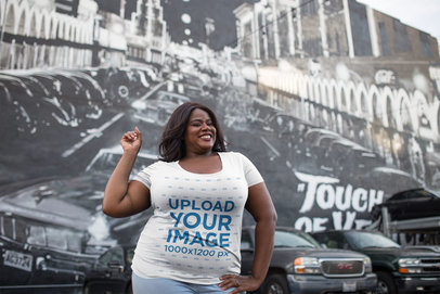 Plus Size T-Shirt Mockup of Happy Woman Against a Venice Beach Wall Mural 18300