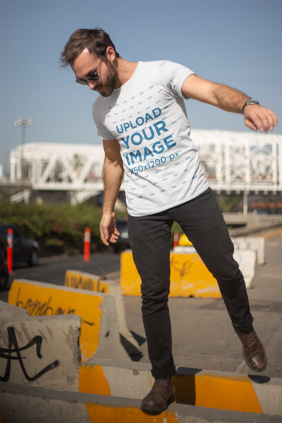 T-Shirt Mockup of a Man Balancing on a Ledge 20057