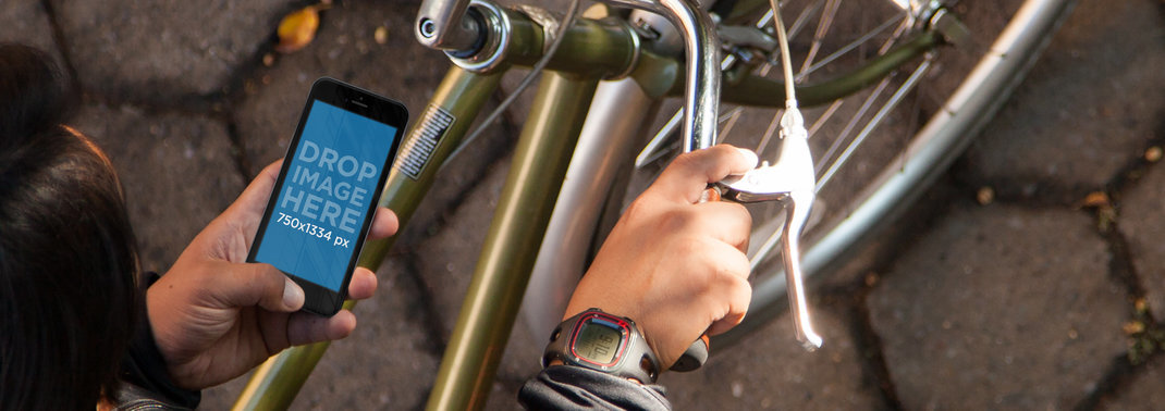 iPhone 6 Mockup of a Young Man Using an iPhone While Riding a Bike