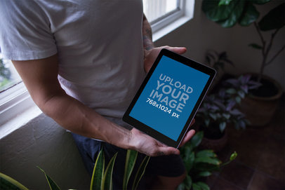 iPad Mockup Held by a Man 22825