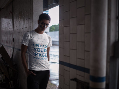 Mockup of a Man Wearing a T-Shirt and Halloween Makeup in an Abandoned Place