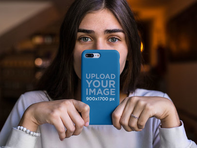 Mockup of a Girl Holding an iPhone Case in Front of Her Face 22886