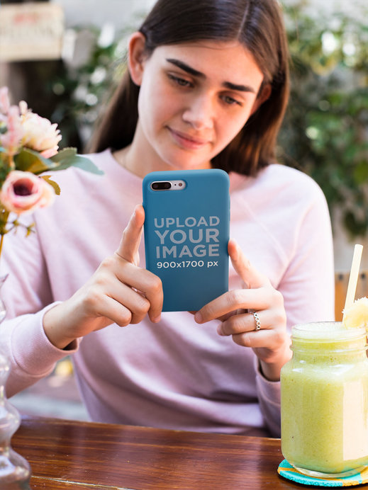 iPhone Case Mockup of a Woman in a Restaurant 