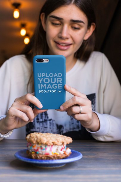 iPhone Case Mockup Featuring a Pretty Woman Taking a Picture of a Cookie