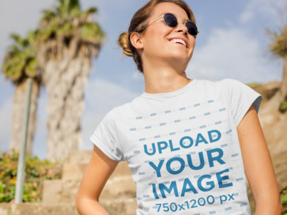 Mockup of a Woman Wearing a T-Shirt in a Sunny Day