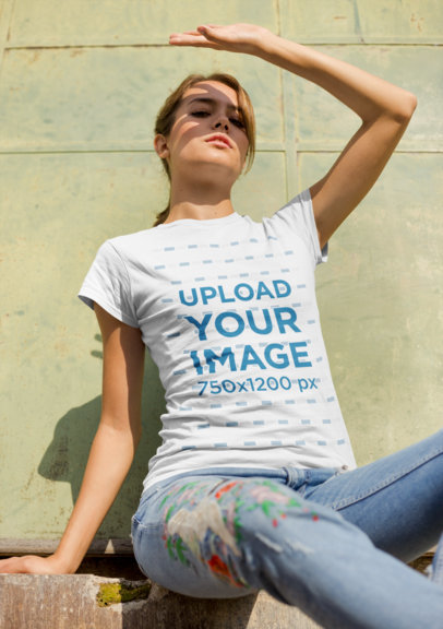 Mockup of a Woman Wearing a T-Shirt and Embroidered Jeans