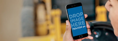 iPhone 6 Mockup Featuring a Construction Worker Driving a Truck a4073