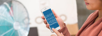 Mockup of a Woman Using Her White iPhone 6 While Shopping