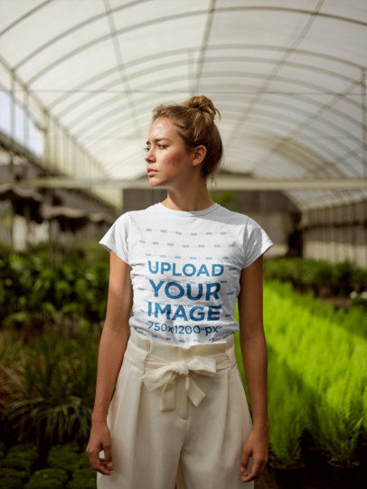 T-Shirt Mockup Featuring a Sun-Kissed Woman with a Messy Bun