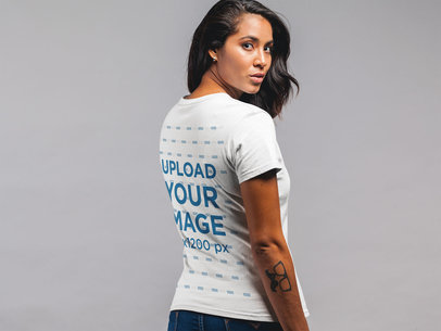 Back Shot T-Shirt Mockup Featuring a Pretty Woman With Wavy Hair 