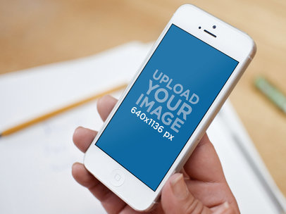 Mockup of a Vertical White iPhone 