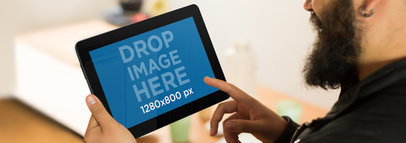 Tablet Mockup of a Bearded Man Using an Asus Tablet