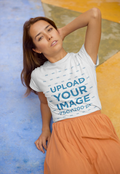 T-Shirt Mockup of a Woman Resting With Her Elbow on the Floor  22509