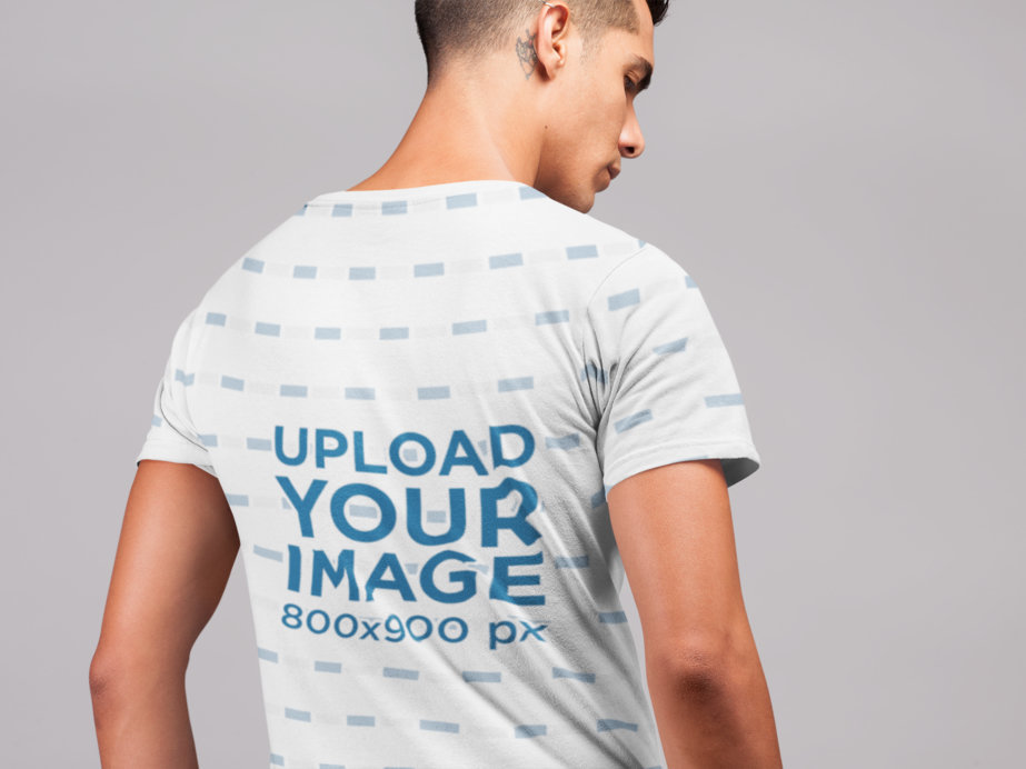 Mockup of a Man Wearing a T-Shirt in a Studio