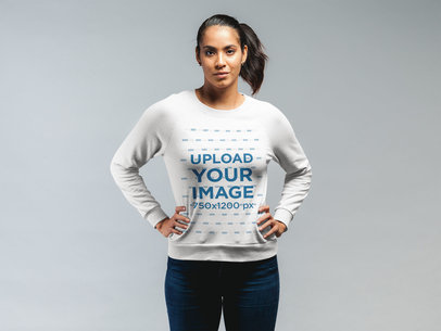 Sweatshirt Mockup Featuring a Woman Standing With Her Hands on Her Hips