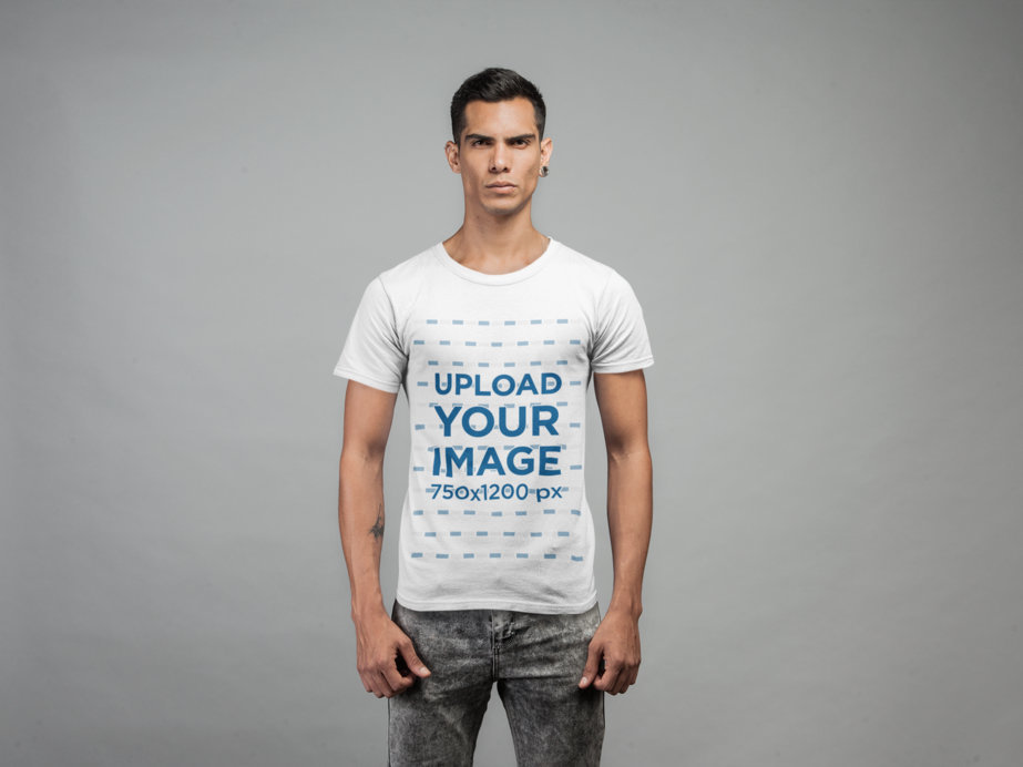 Mockup of a Serious Tattooed Man Wearing a T-Shirt in a Studio