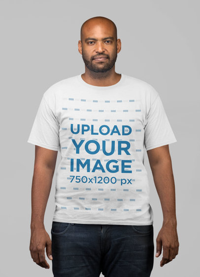 Plain T Shirt Mockup Featuring a Man Against a Flat Background
