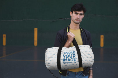 Mockup of a Young Man Carrying a Duffle Bag