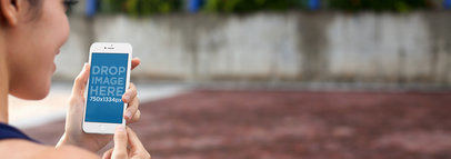 Lady Using Her iPhone 6 at the Running Track Mockup