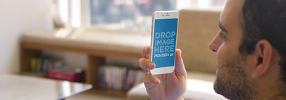 iPhone 6 Mockup Template of a Man Relaxing at Home