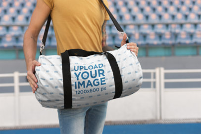 Mockup of a Man Carrying a Kit Bag at a Stadium