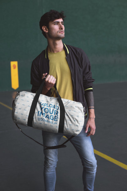 Mockup of a Gym Bag Held Casually by a Man