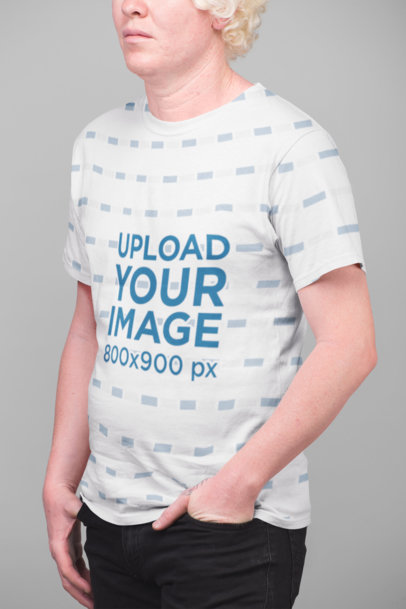 Mockup of a Serious Man Wearing a Sublimated Tshirt Against a Flat Background
