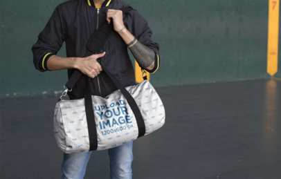 Duffel Bag Mockup of a Man at a Green and Yellow Court