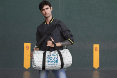 Mockup of a Man Holding a Gym Bag