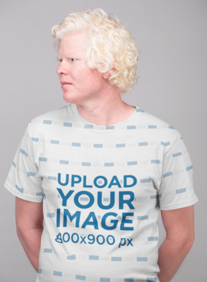 Sublimated T-Shirt Mockup of a Man Looking Away at a Studio