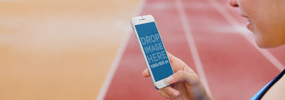 iPhone 6 Mockup of a Woman at a Running Track