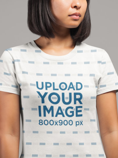  Mockup of a Woman Wearing an All-Over T-Shirt at a Studio