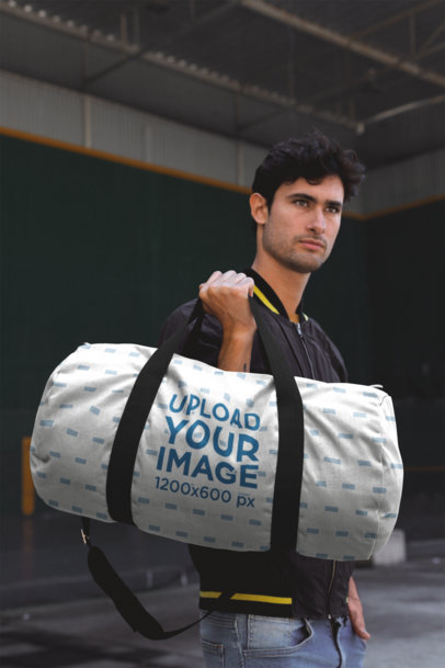 Gym Bag Mockup Featuring a Handsome Man Carrying the Gym Bag