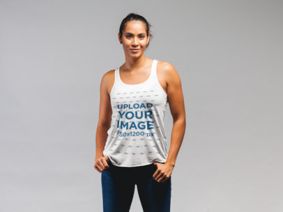 Tank Top Mockup Featuring a Fit Woman Posing Against a Flat Background