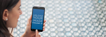 Android Mockup of a Young Woman With a Black Samsung Galaxy