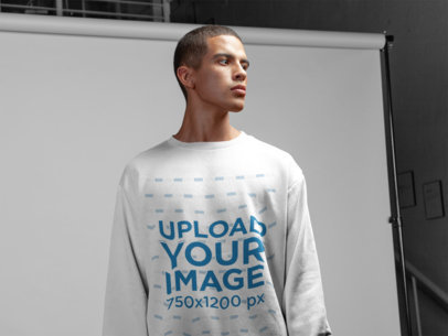 Crewneck Sweater Mockup of a Serious Man at a Studio Set