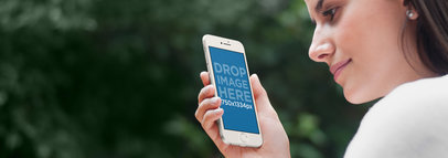iPhone 6 Mockup Template of a Young Lady at the Garden