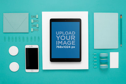 Mockup Featuring an iPad on a Flat Lay Background