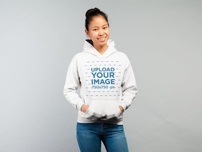 Hoodie Mockup Featuring a Woman in a Casual Look Against a White Background