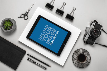 Mockup of an iPad on a Photographer's Desk Set Up