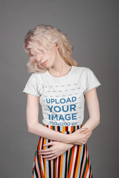T-Shirt Mockup Featuring a Woman Wearing a Striped Skirt