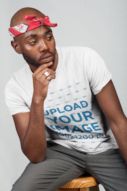 Mockup Featuring a Man Wearing a T-Shirt at a Studio in a Cool Pose